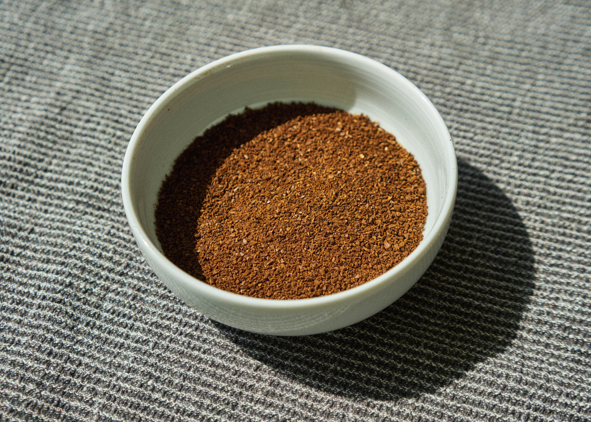 Bowl of freshly ground Ainanani Kona Sunrise Blend coffee